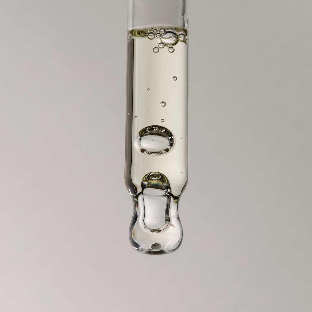 Close up for pure clarity oil texture in a dropper