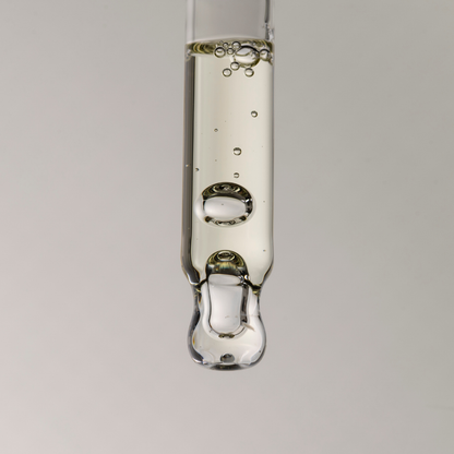 Close up for pure clarity oil texture in a dropper
